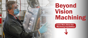 Picture of Beyond Vision employee operating a machine. Text says " Beyond Vision Machining"