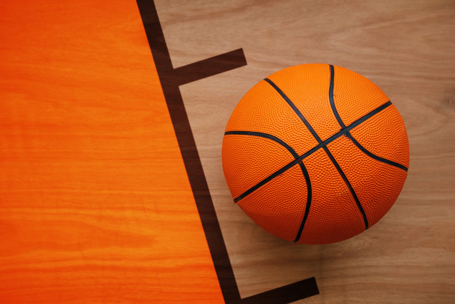 Basketball ball on court floor